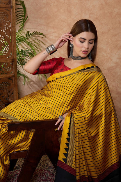 Sensational Yellow Ajrakh Printed Semi Modal Silk Saree With Resonant Blouse Piece