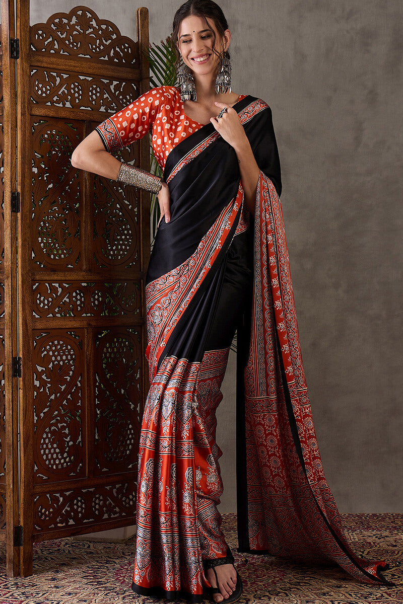 Enticing Black Ajrakh Printed Semi Modal Silk Saree With Winsome Blouse Piece