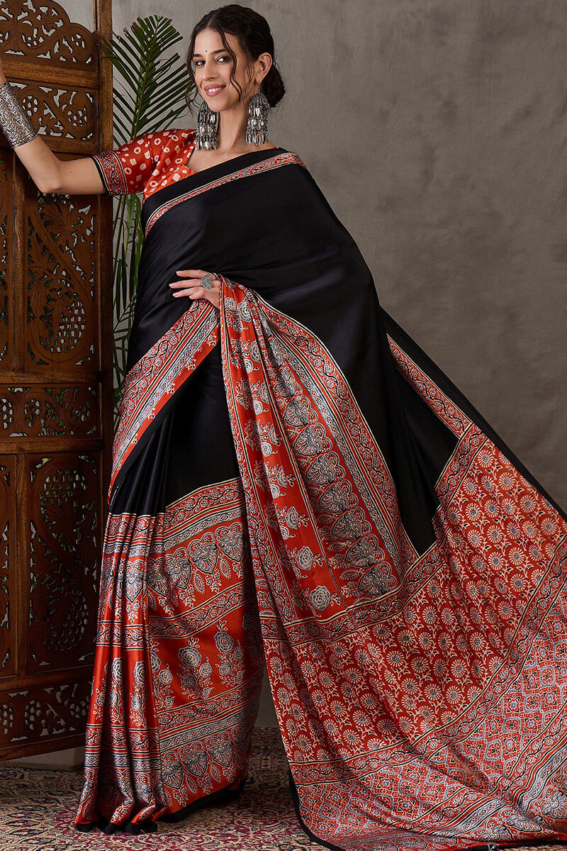 Enticing Black Ajrakh Printed Semi Modal Silk Saree With Winsome Blouse Piece