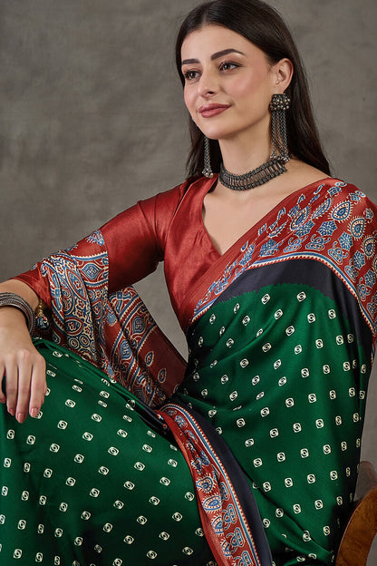 Deserving Dark Green Ajrakh Printed Semi Modal Silk Saree With Stunner Blouse Piece
