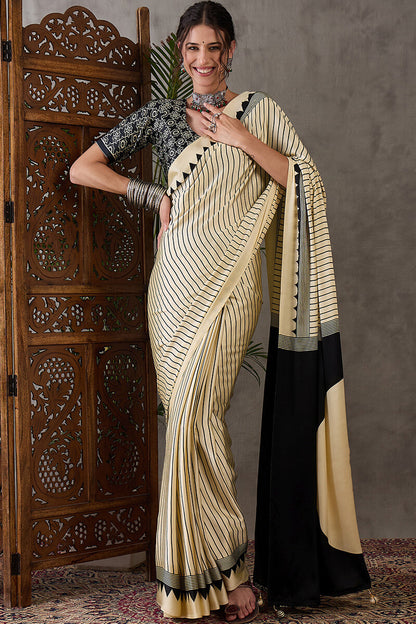 Alluring Beige Ajrakh Printed Semi Modal Silk Saree With Cynosure Blouse Piece