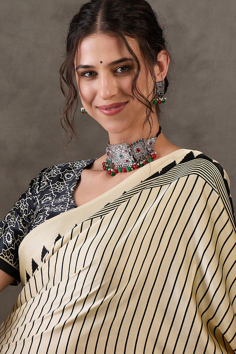Alluring Beige Ajrakh Printed Semi Modal Silk Saree With Cynosure Blouse Piece