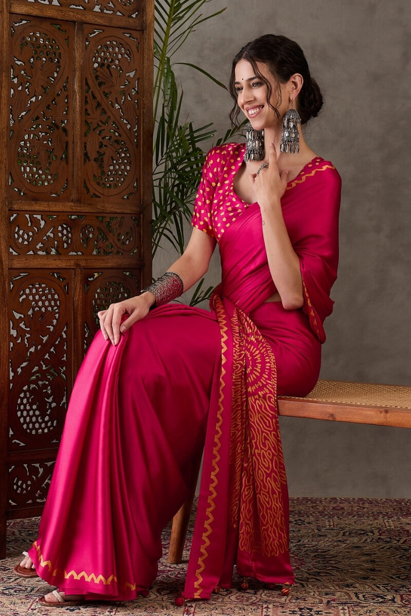 Appealing Dark Pink Ajrakh Printed Semi Modal Silk Saree With Elision Blouse Piece