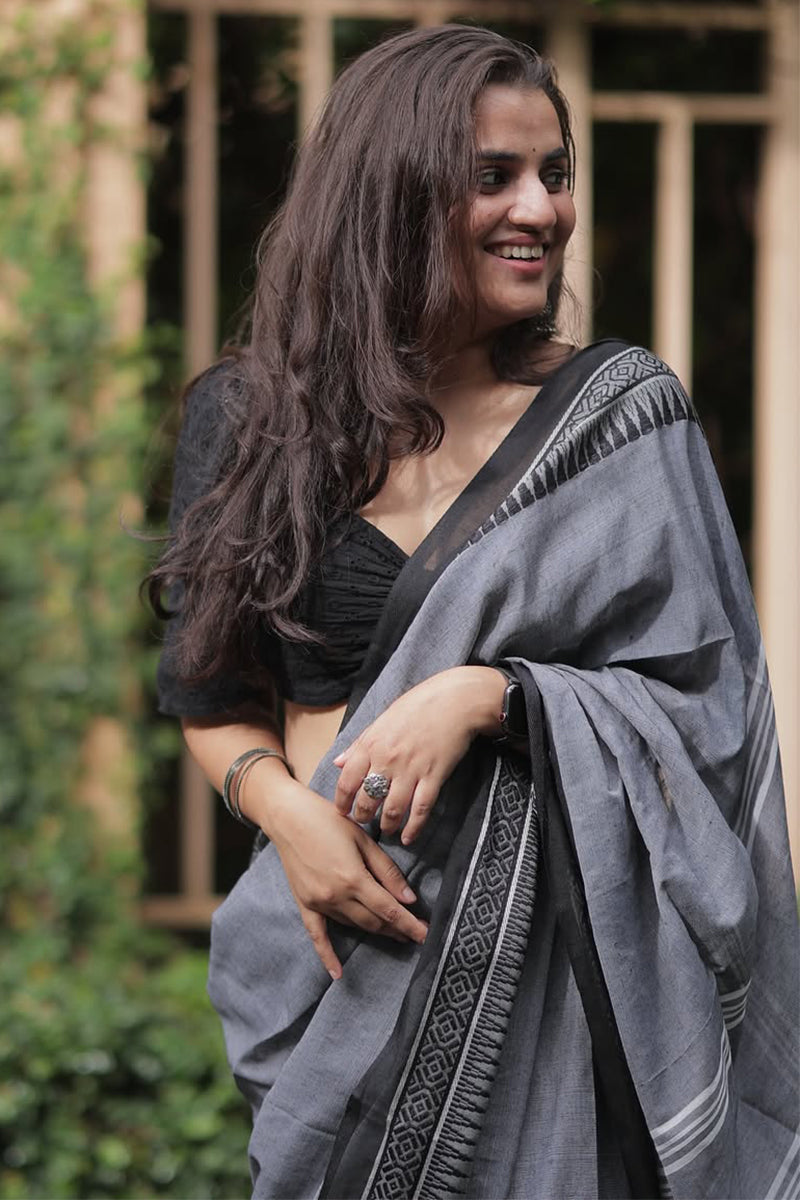 Prominent Grey Cotton Silk Saree With Enamoring Blouse Piece