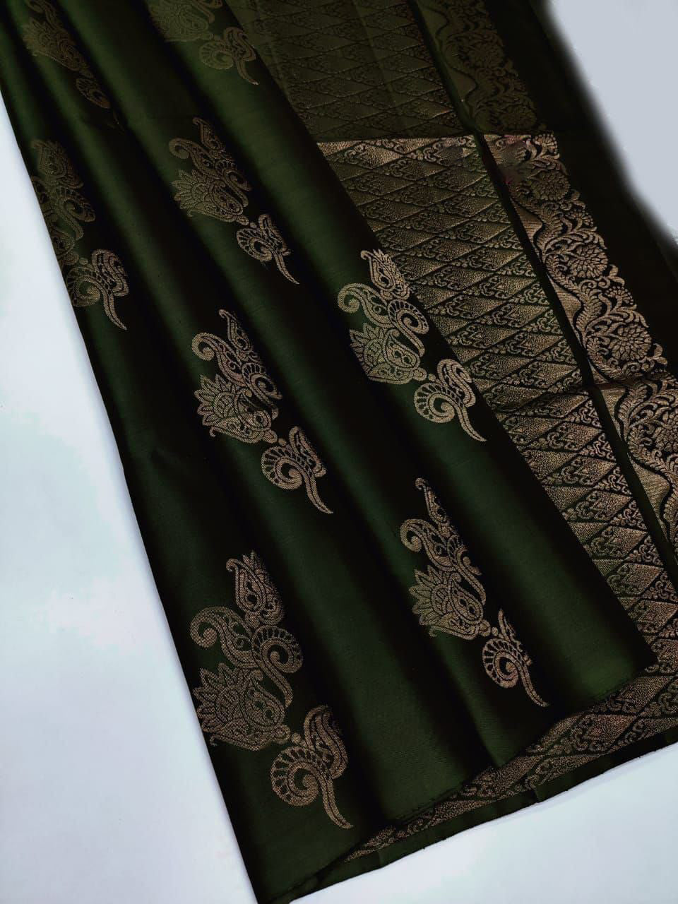 Evanescent Dark Green Soft Silk Saree With Lustrous Blouse Piece