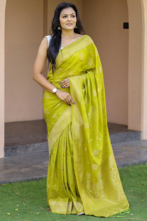 Load image into Gallery viewer, Inspiring Mehndi Soft Silk Banarasi Saree With Gossamer Blouse Piece
