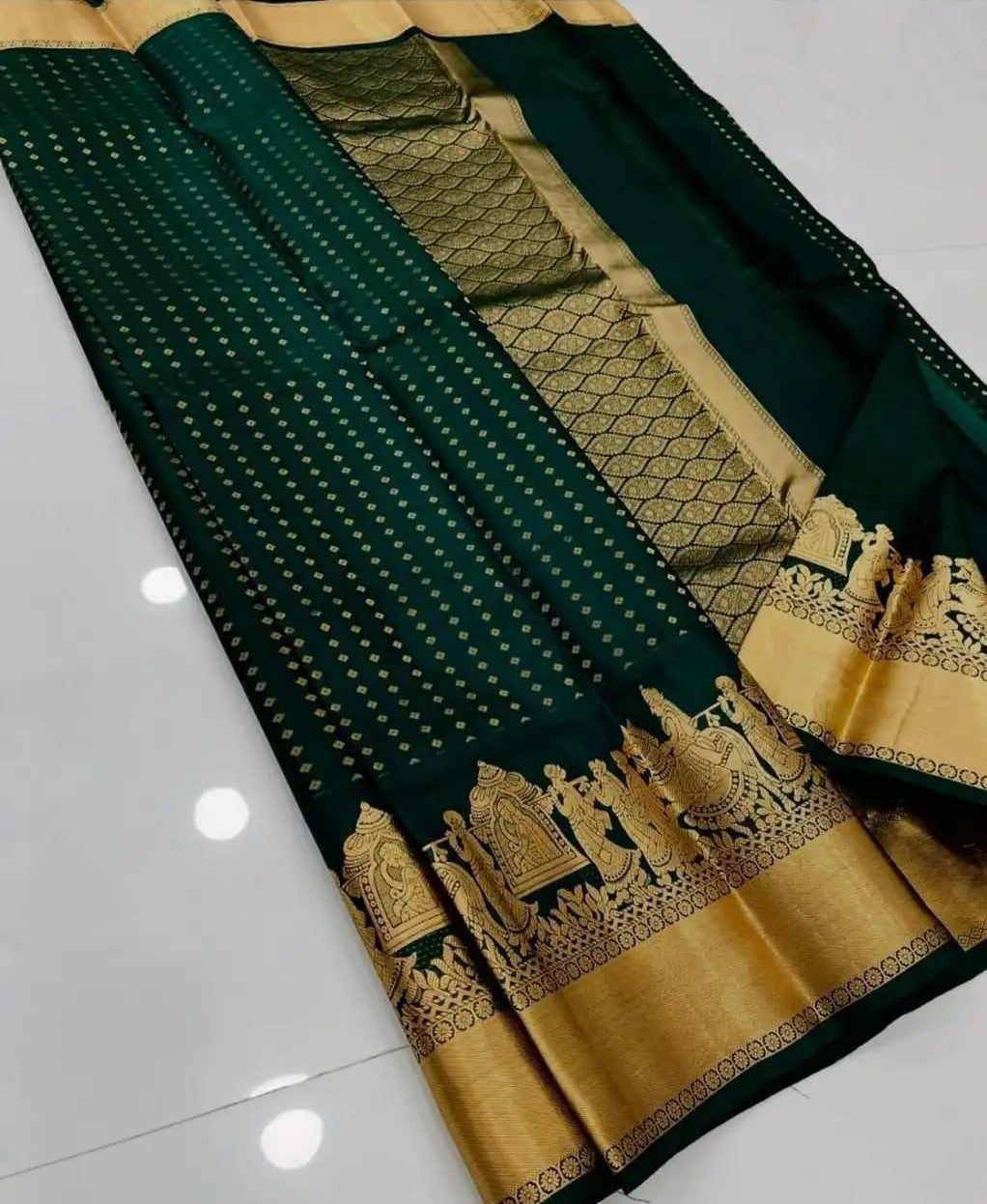 Elaborate Dark Green Soft Silk Saree With Grandiose Blouse Piece