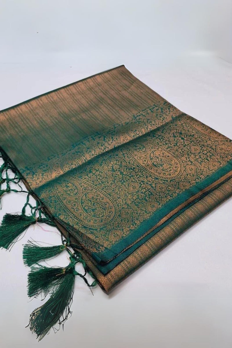 Intricate Dark Green Kanjivaram Silk Saree With Jazzy Blouse Piece