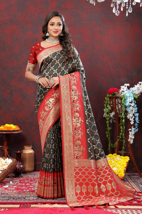 Load image into Gallery viewer, Gleaming Dark Green Patola Silk Saree with Posh Blouse Piece
