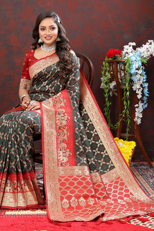 Load image into Gallery viewer, Gleaming Dark Green Patola Silk Saree with Posh Blouse Piece
