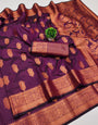 Ornate Purple Soft Banarasi Silk Saree With Zephyr Blouse Piece