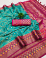 Cynosure Sea Green Soft Banarasi Silk Saree With Assemblage Blouse Piece