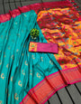 Inimitable Turquoise Paithani Silk Saree With Vibrant Blouse Piece