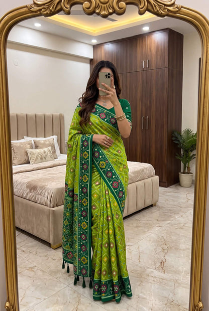 Staring Green Patola Silk Saree with Profuse Blouse Piece