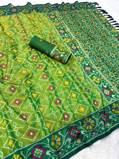 Staring Green Patola Silk Saree with Profuse Blouse Piece