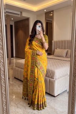 Flattering Yellow Patola Silk Saree with Fugacious Blouse Piece