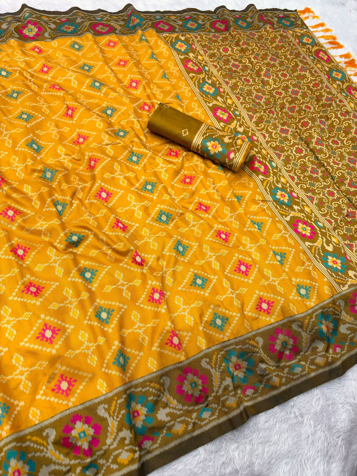 Flattering Yellow Patola Silk Saree with Fugacious Blouse Piece