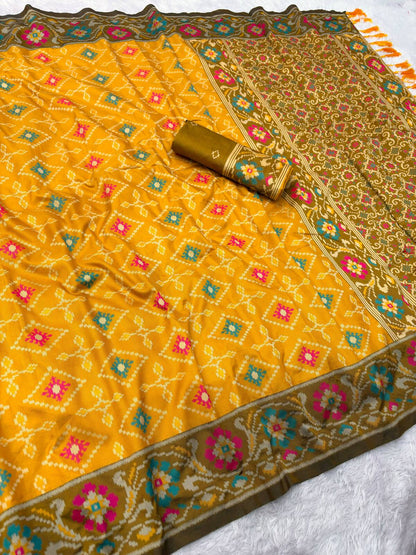 Flattering Yellow Patola Silk Saree with Fugacious Blouse Piece