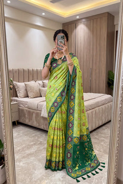 Pleasant Green Patola Silk Saree with Piquant Blouse Piece