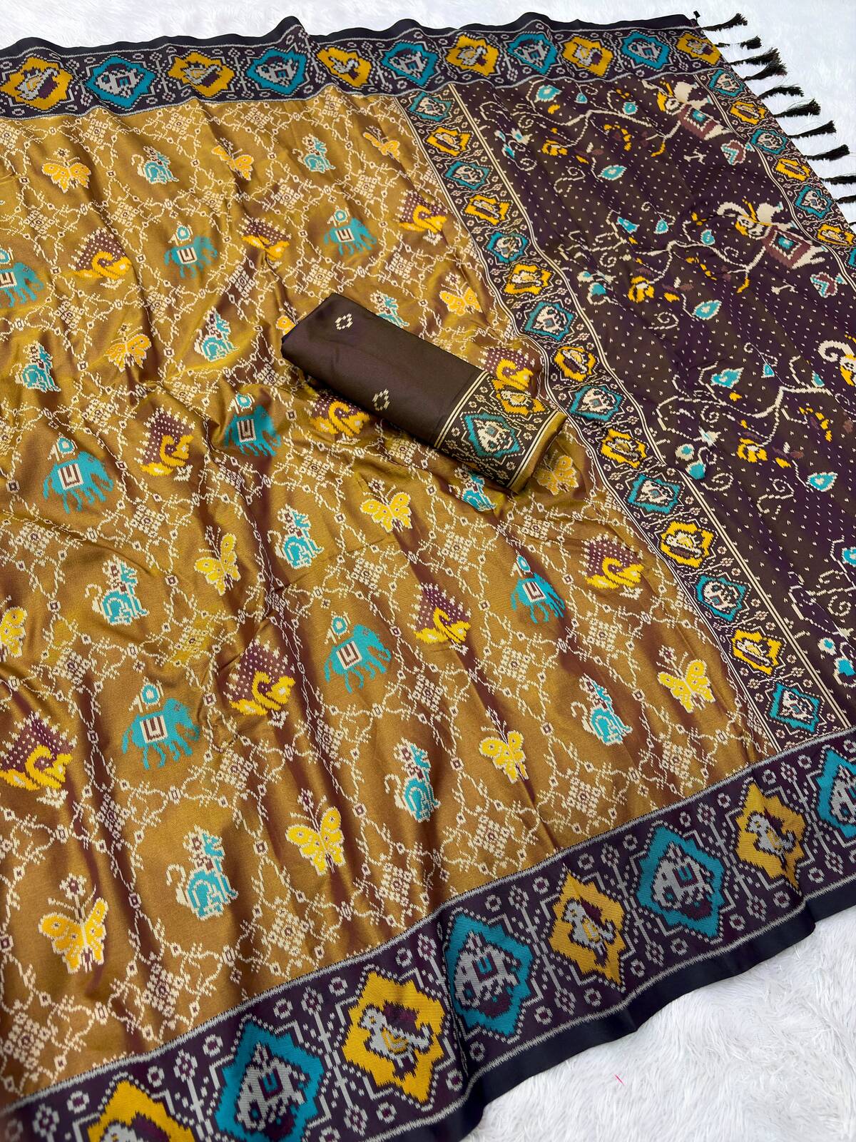 Confounding Mustard Patola Silk Saree with Propinquity Blouse Piece