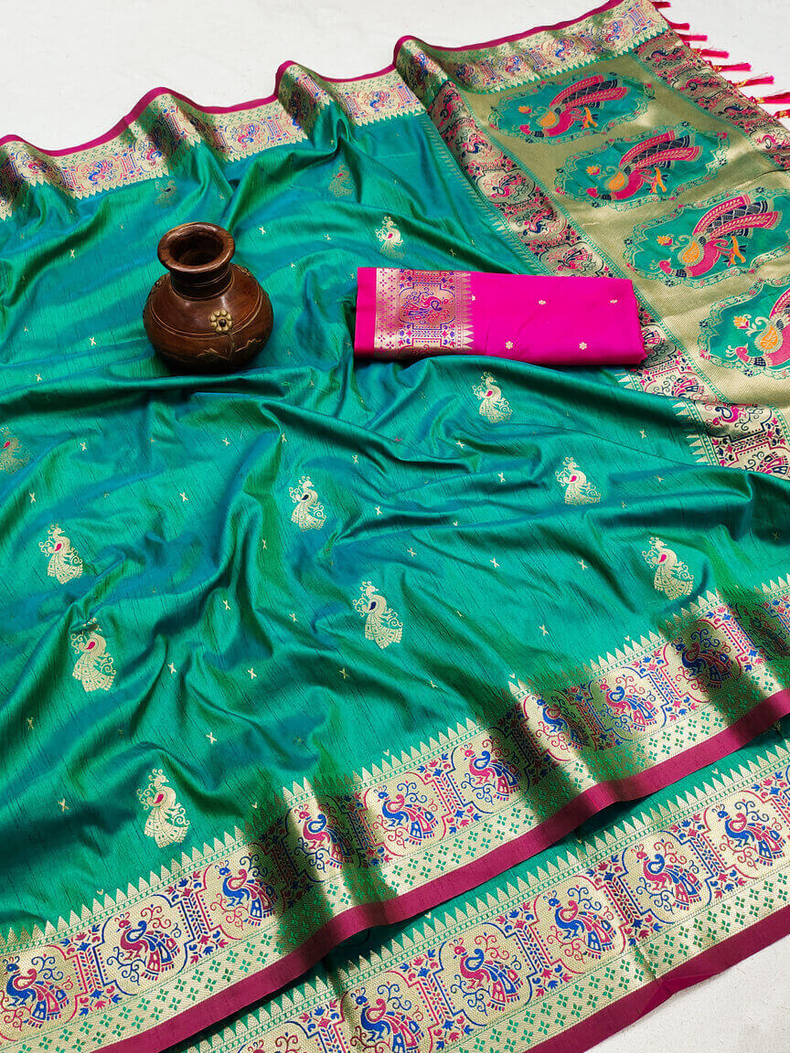 Prominent Turquoise Paithani Silk Saree With Brood Blouse Piece