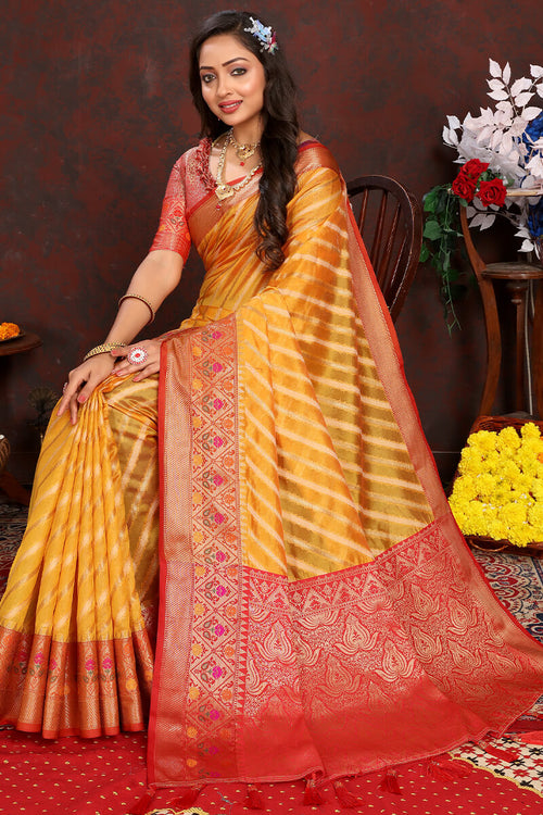 Load image into Gallery viewer, Flaunt Yellow Soft Banarasi Silk Saree With Flattering Blouse Piece
