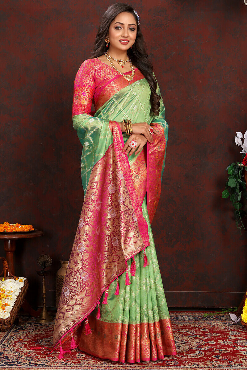 Twirling Pista Soft Banarasi Silk Saree With Traditional Blouse Piece