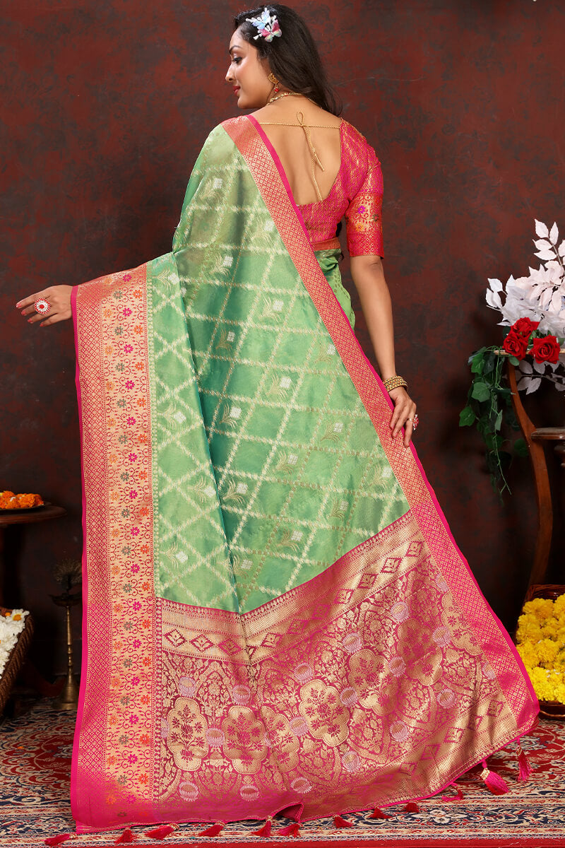 Twirling Pista Soft Banarasi Silk Saree With Traditional Blouse Piece