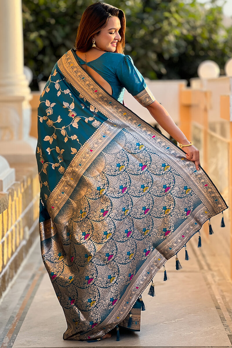 Ineffable Teal Blue Soft Banarasi Silk Saree With Zephyr Blouse Piece