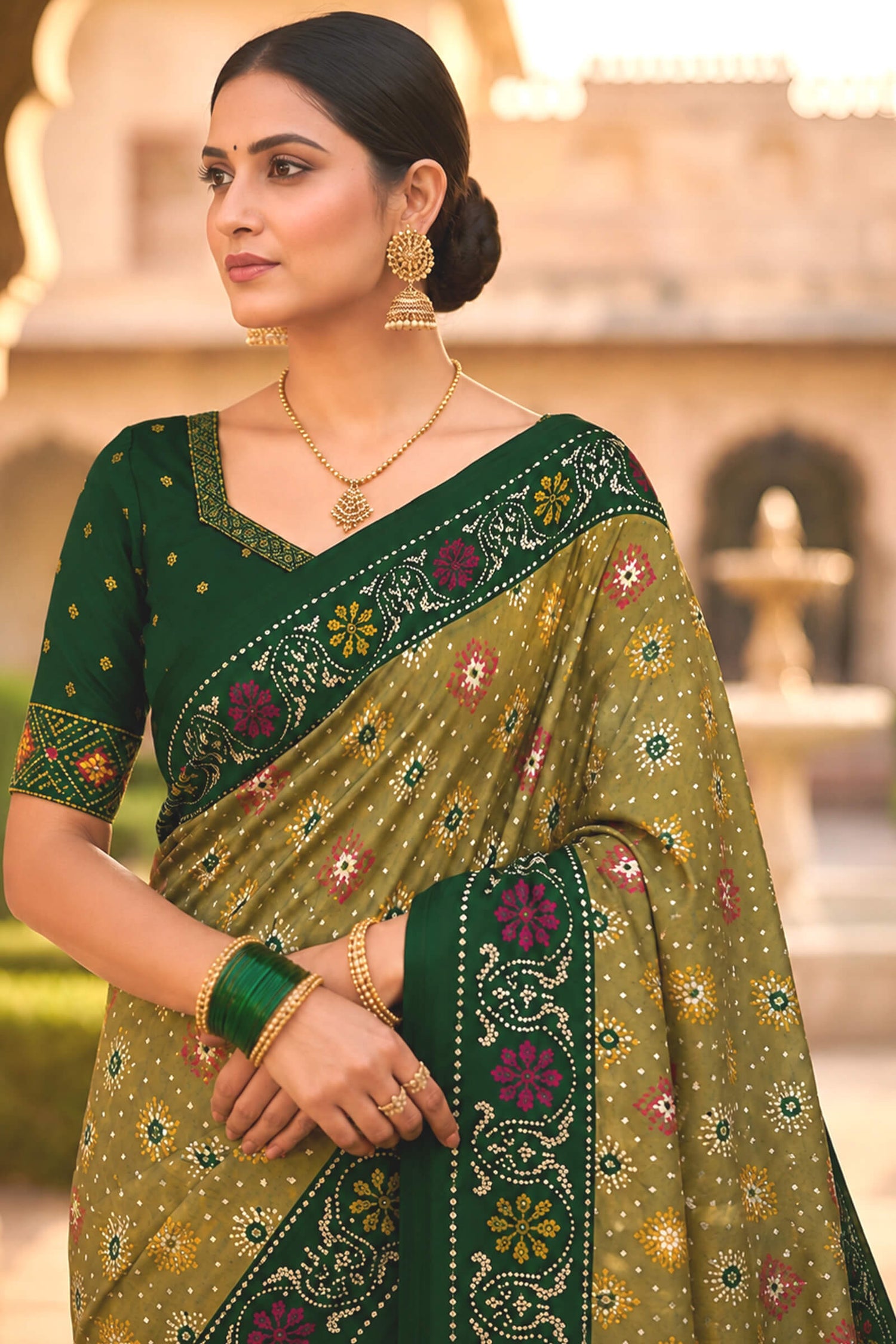 Engaging Green Patola Silk Saree with Smart Blouse Piece