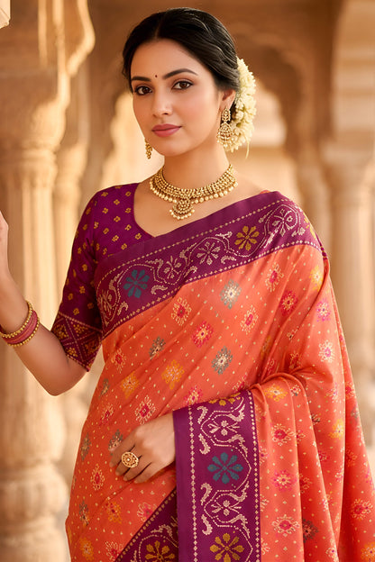 Beauteous Orange Patola Silk Saree with Denouement Blouse Piece