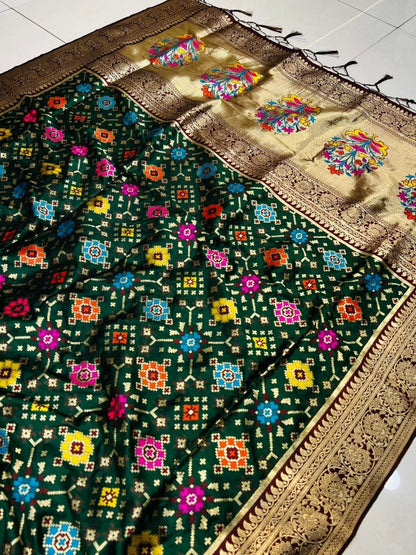 Sophisticated Dark Green Soft Patola Silk Saree with Demanding Blouse Piece