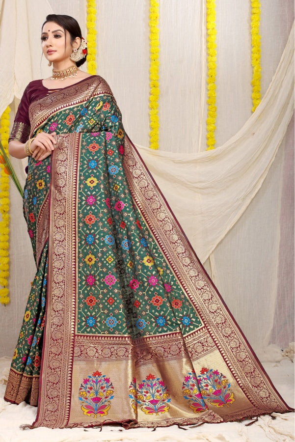 Sophisticated Dark Green Soft Patola Silk Saree with Demanding Blouse Piece