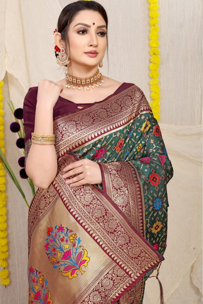 Sophisticated Dark Green Soft Patola Silk Saree with Demanding Blouse Piece