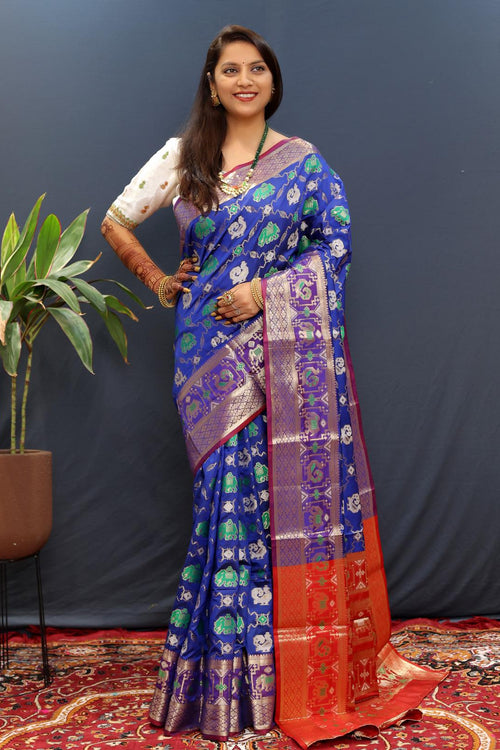 Load image into Gallery viewer, Beleaguer Blue Patola Silk Saree with Exemplary Blouse Piece
