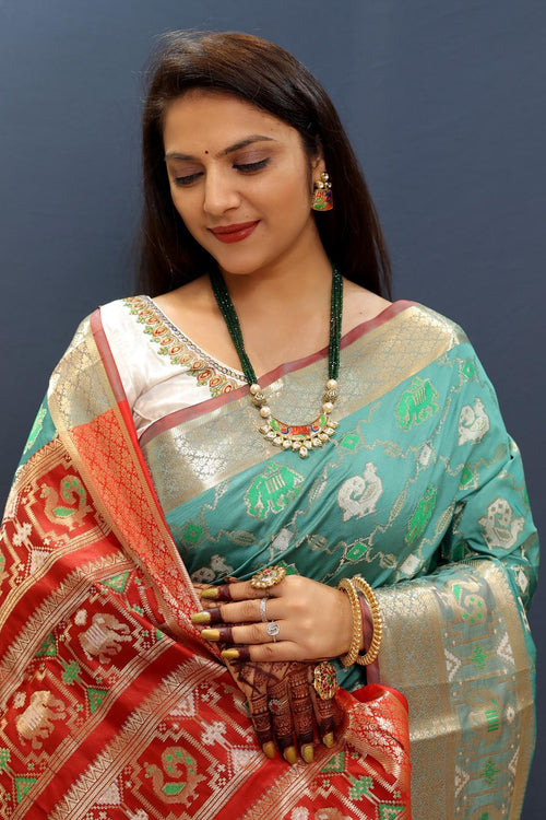 Load image into Gallery viewer, Susurrous Sky Patola Silk Saree with Dulcet Blouse Piece
