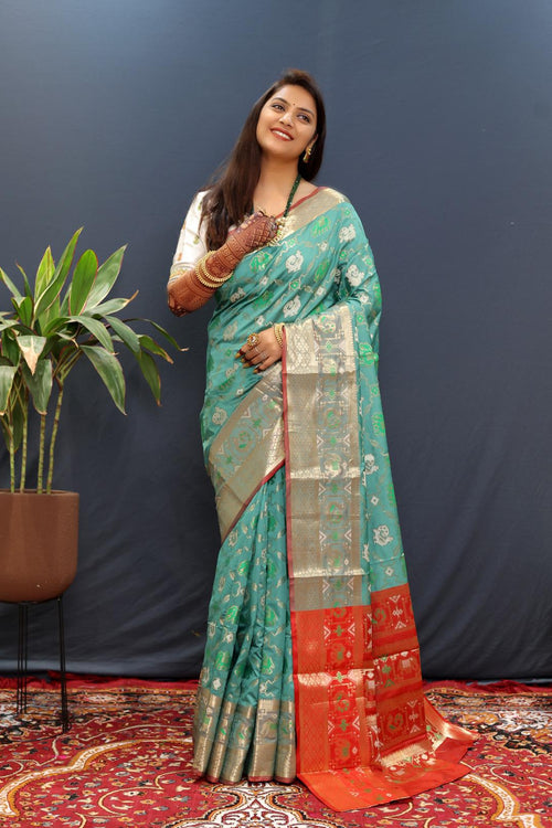 Load image into Gallery viewer, Susurrous Sky Patola Silk Saree with Dulcet Blouse Piece
