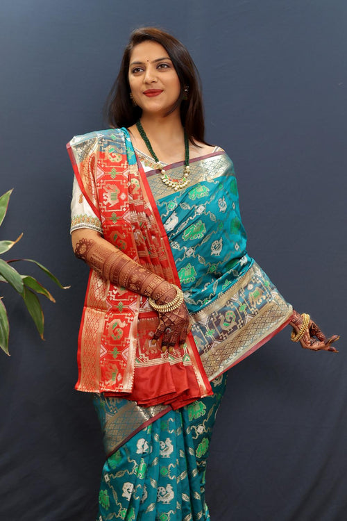 Load image into Gallery viewer, Susurrous Sky Patola Silk Saree with Dulcet Blouse Piece
