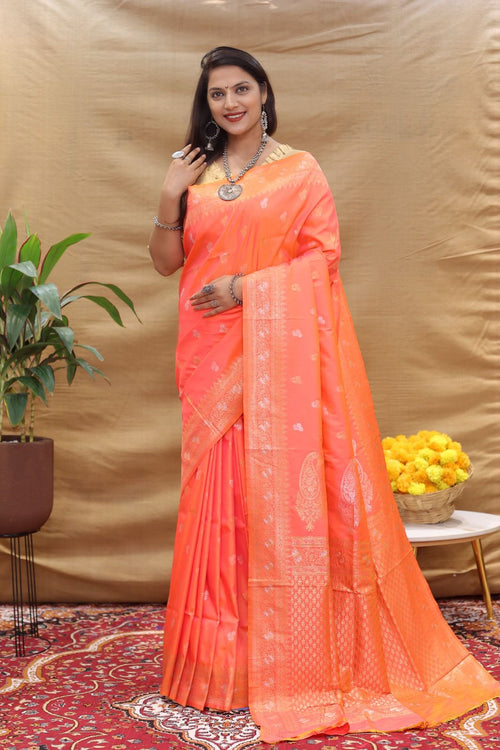 Load image into Gallery viewer, Cynosure Peach Soft Banarasi Silk Saree With Evocative Blouse Piece
