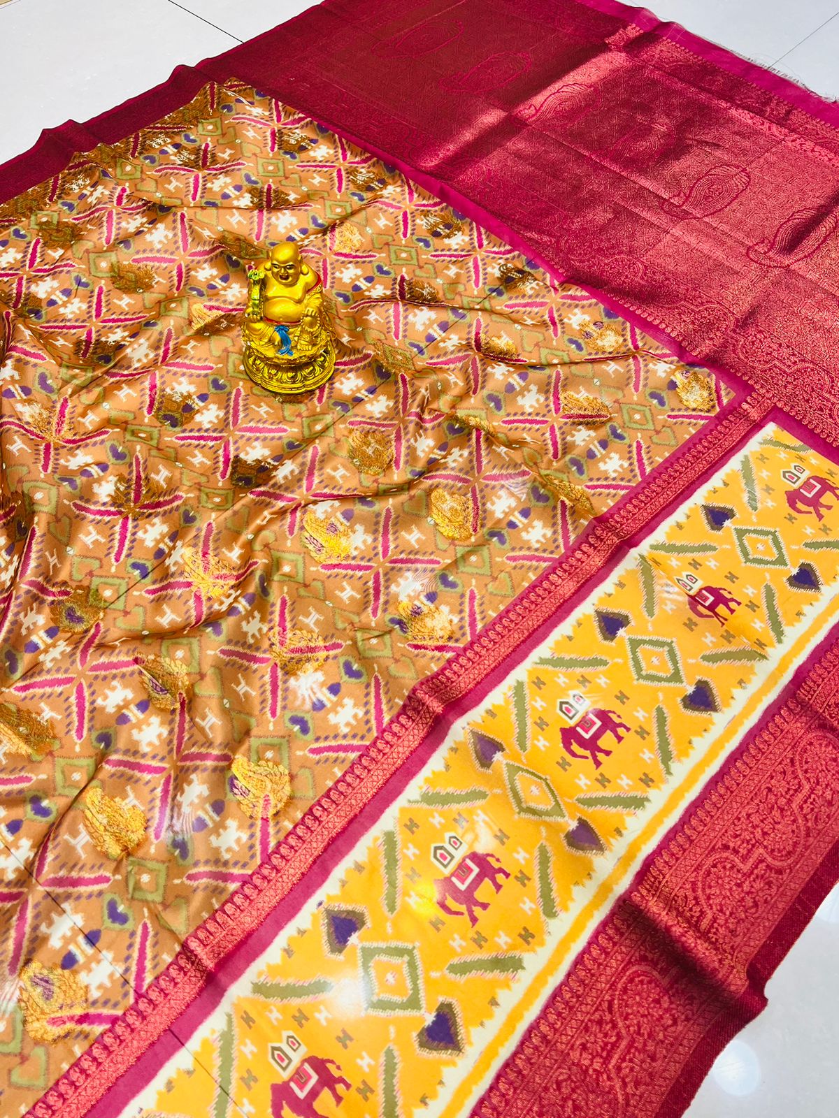 Glowing Peach Patola Silk Saree with Demanding Blouse Piece