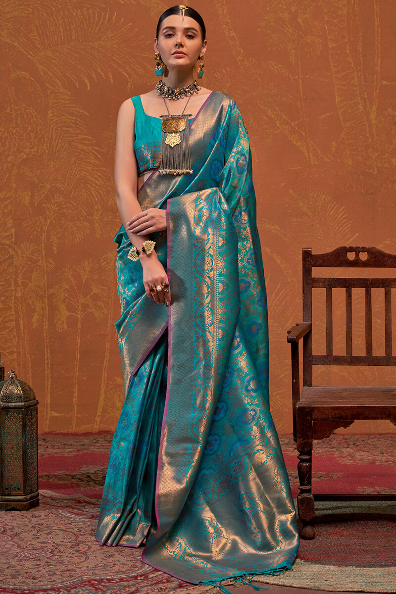 Precious Firozi Kanjivaram Silk Saree With Gleaming Blouse Piece