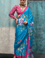 Enthralling Firozi Digital Printed Crape Silk Saree With Allure Blouse Piece