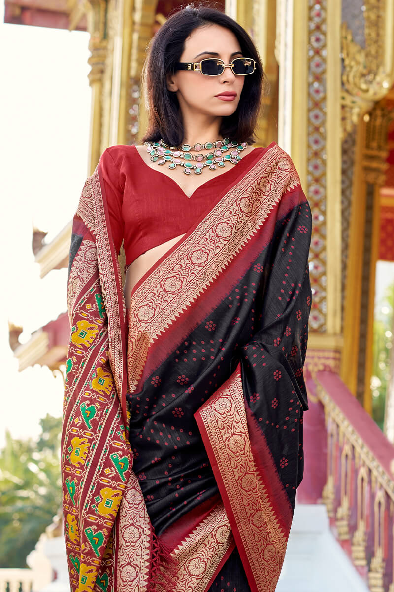 Lassitude Black Patola Silk Saree with Propinquity Blouse Piece