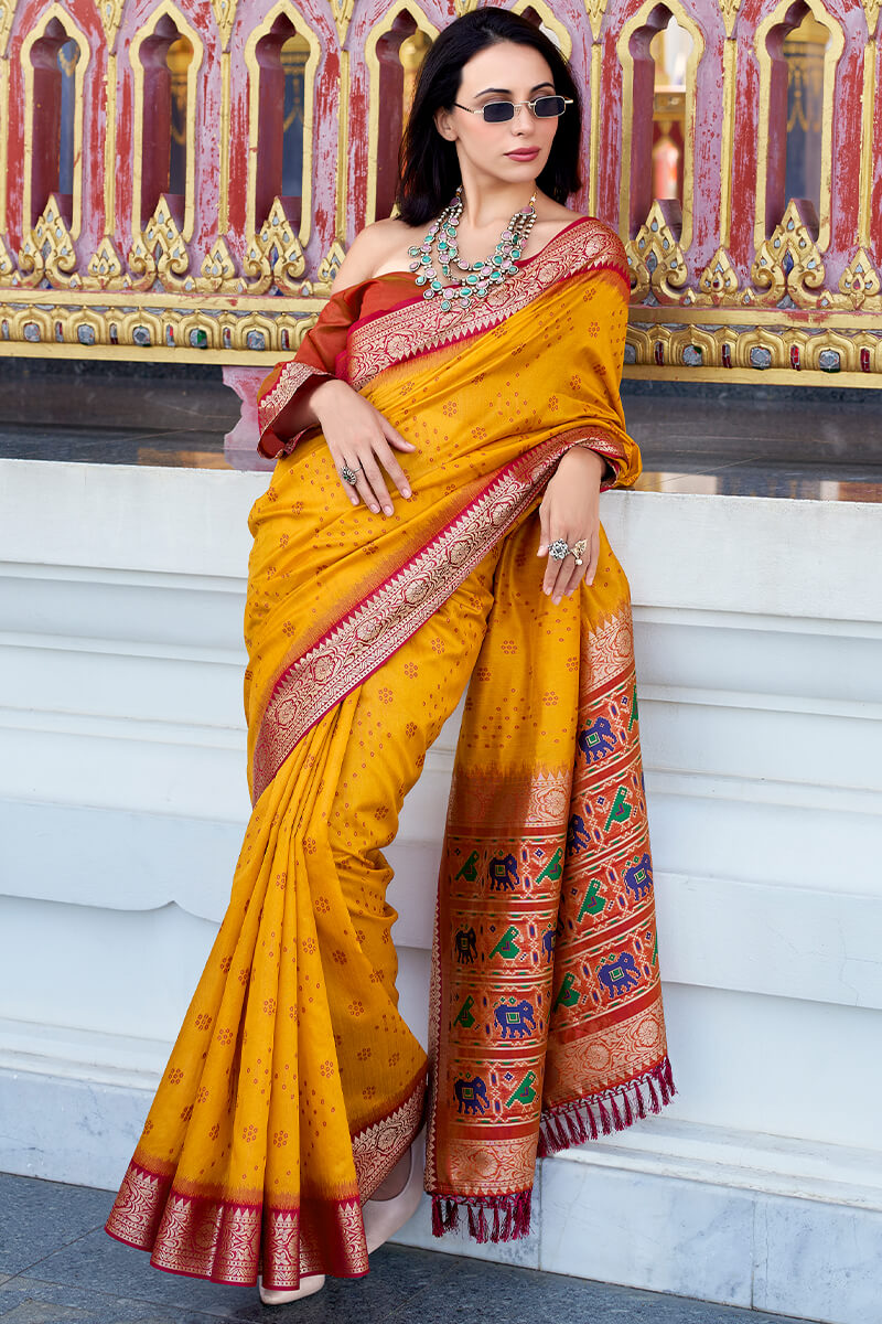 Unequalled Yellow Patola Silk Saree with Enthralling Blouse Piece