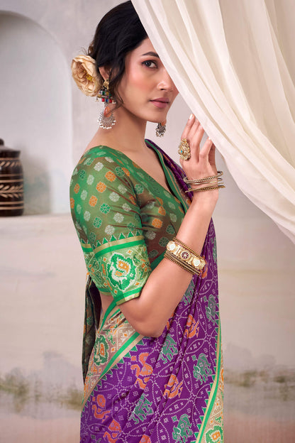 Engrossing Purple Patola Silk Saree With Fairytale Blouse Piece