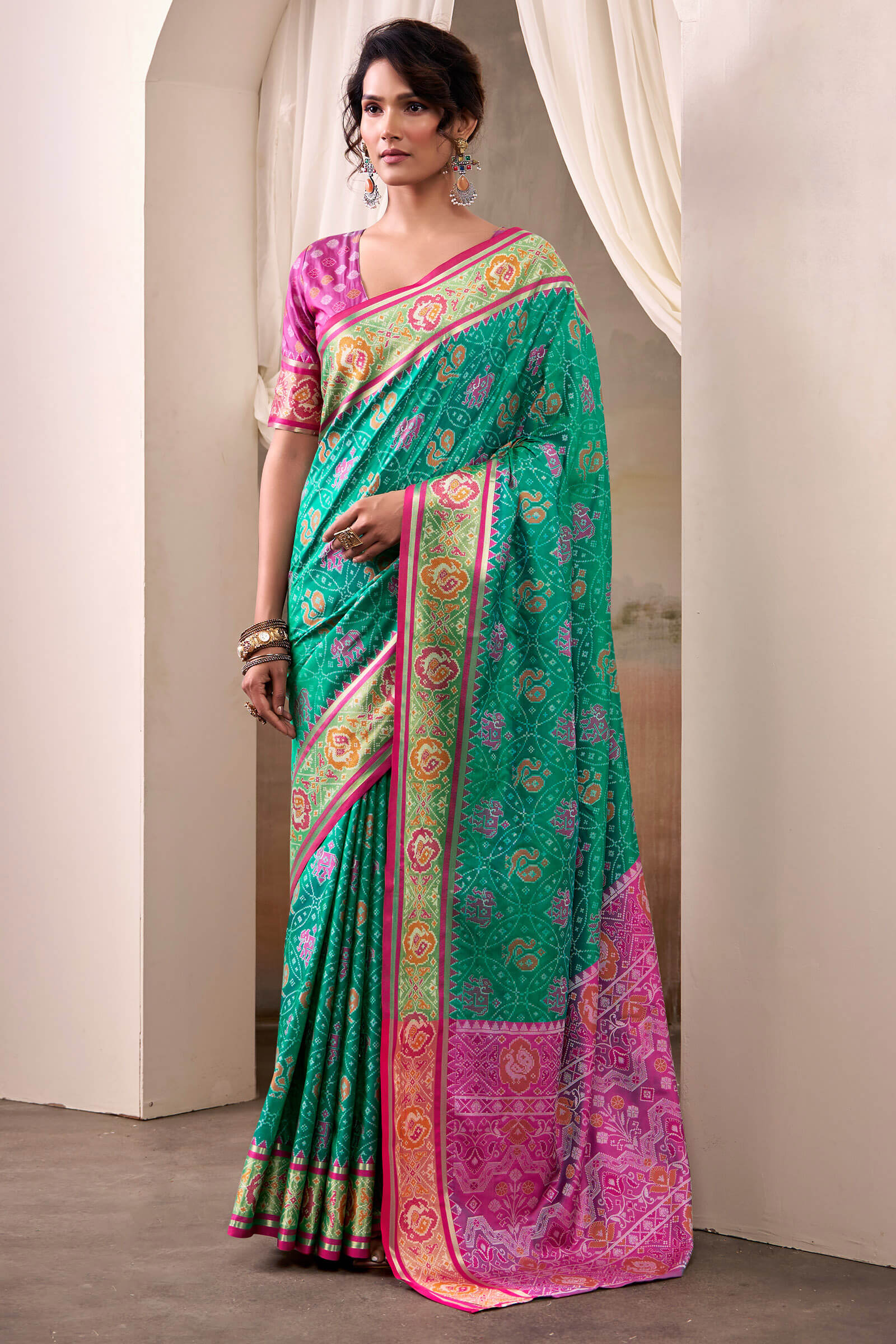 Radiant Rama Patola Silk Saree With Effulgent Blouse Piece
