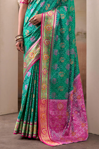 Radiant Rama Patola Silk Saree With Effulgent Blouse Piece