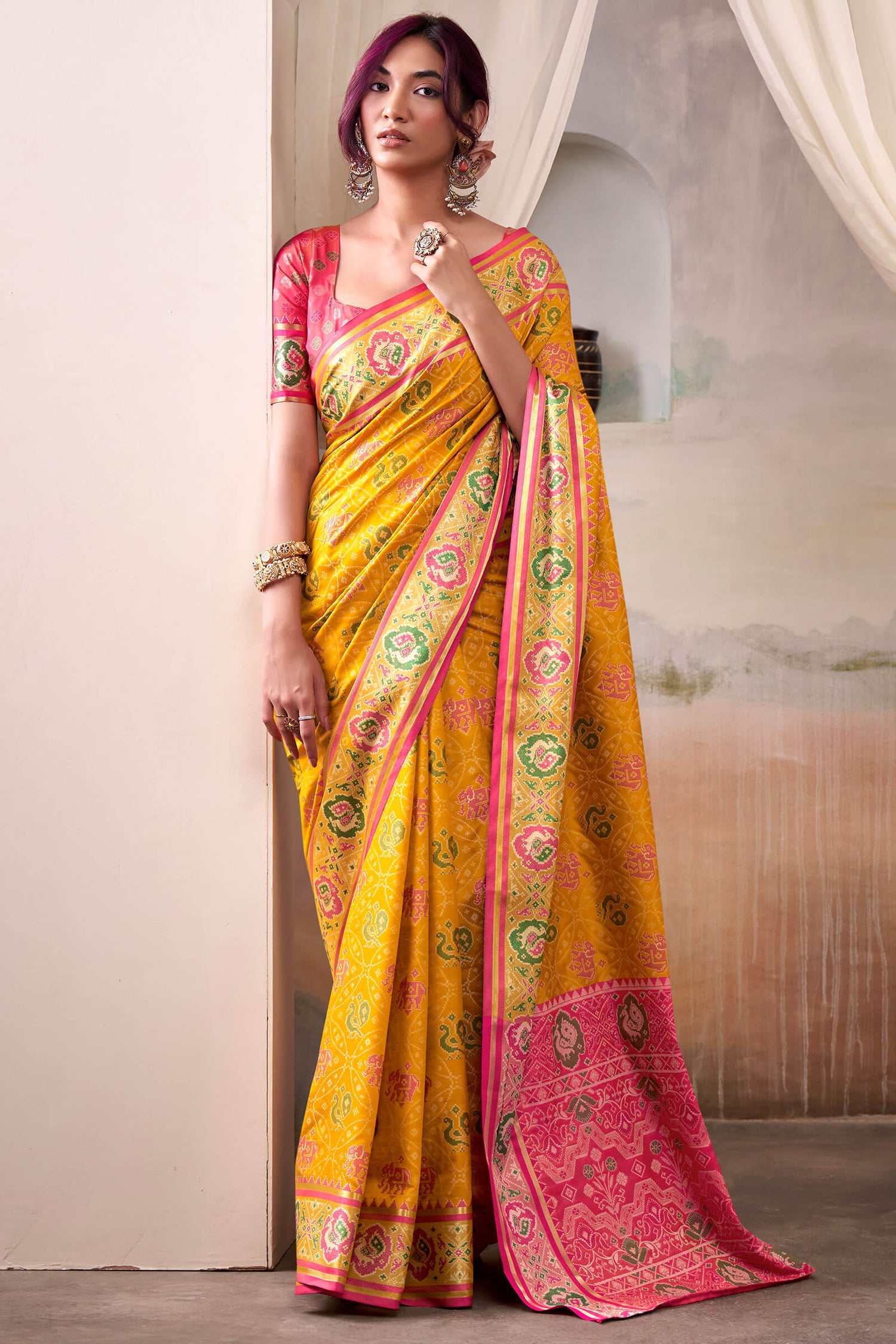 Lustrous Yellow Patola Silk Saree With Desirable Blouse Piece