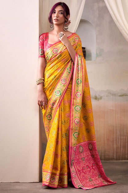 Lustrous Yellow Patola Silk Saree With Desirable Blouse Piece
