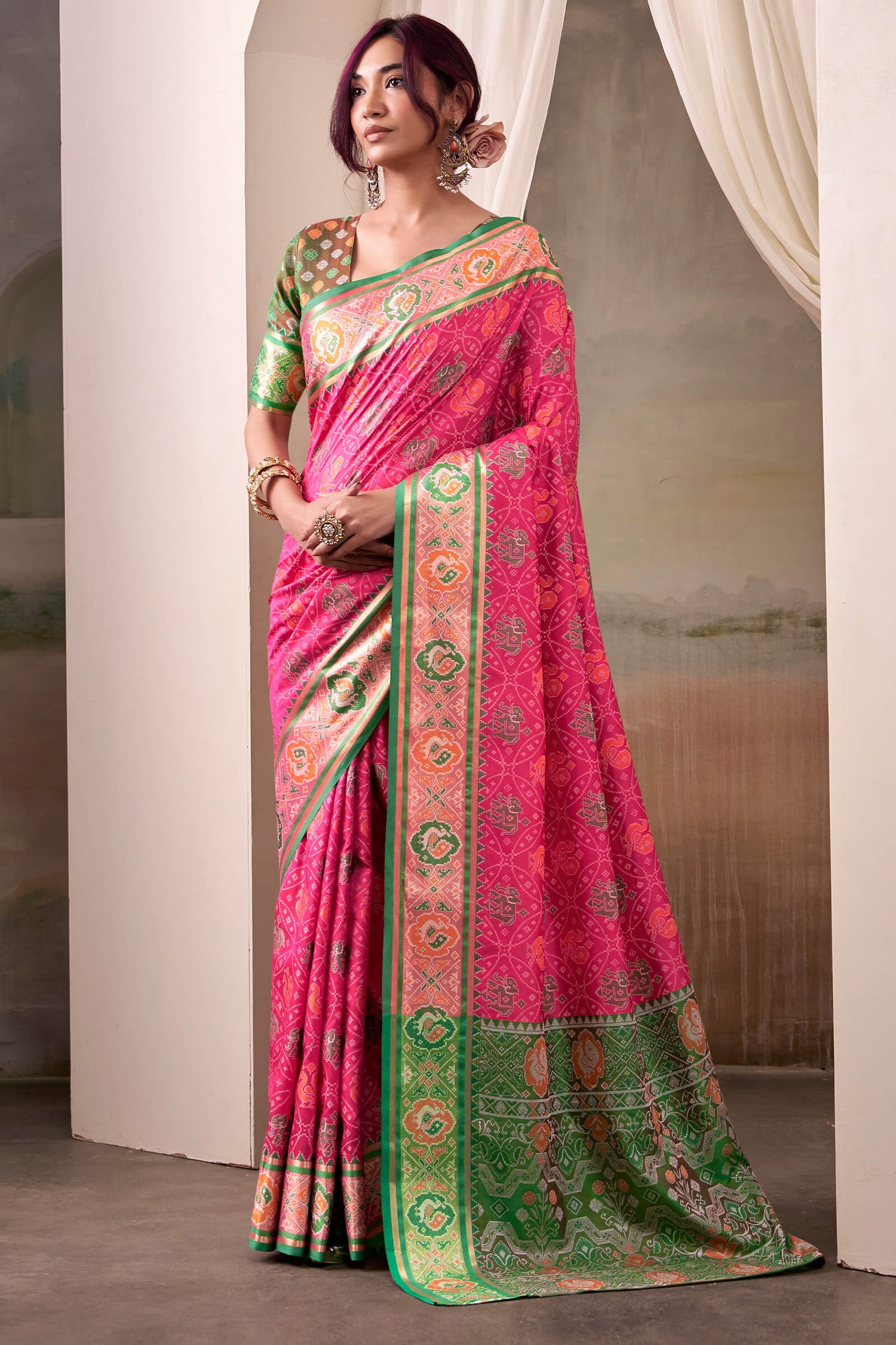 Amiable Pink Patola Silk Saree With Flamboyant Blouse Piece